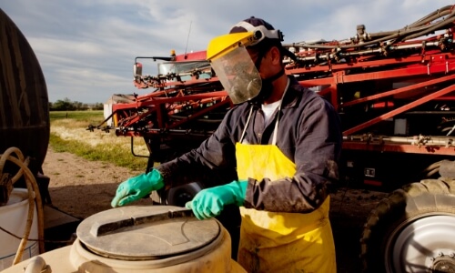 A farmer practicing farm safety